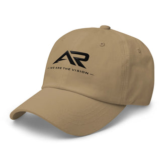 Gorra tipo dad hat color caqui con logo AR y frase 'We Are The Vision' en el frente.