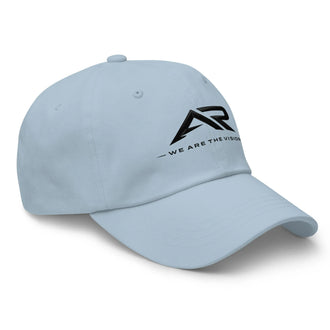Gorra clásica azul claro con logo AR y frase 'We are the vision' en el frente derecho