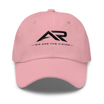 Gorra rosa tipo dad hat con logo AR negro y texto 'We Are The Vision' en el frente